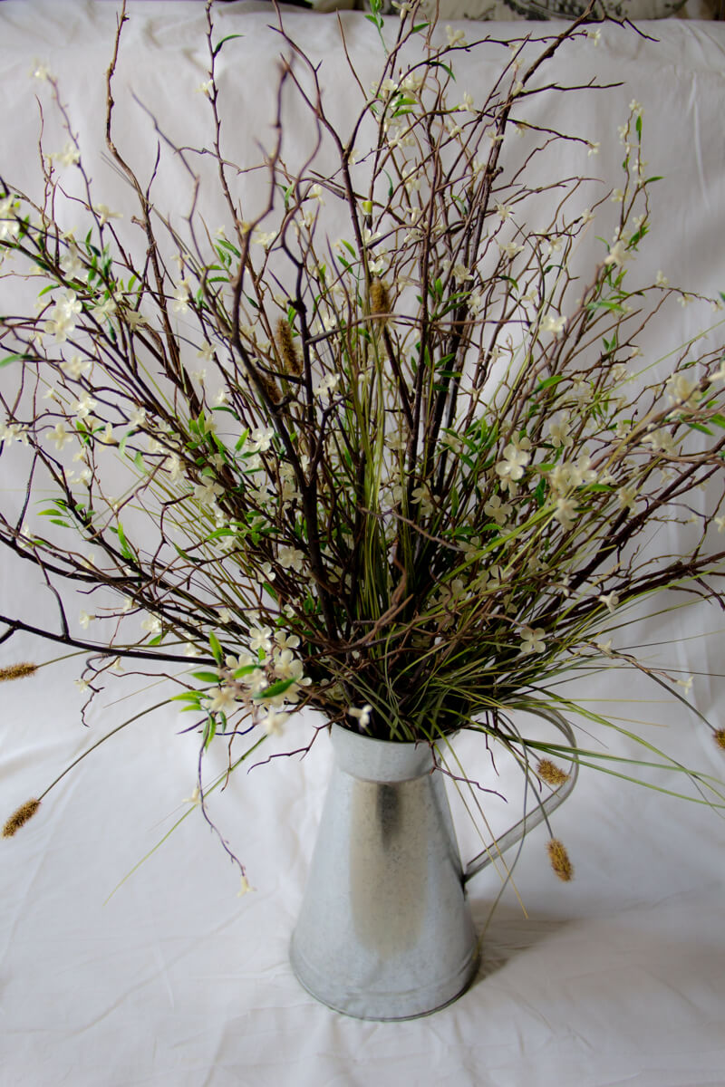 Flower Arrangement twigs in pitcher