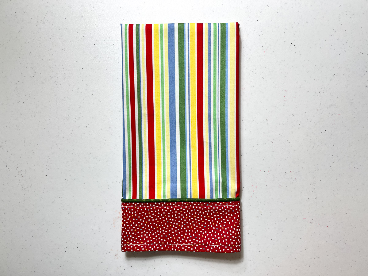 Dish towel with piping